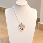 Amulet necklace on ivory bust