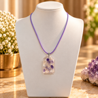 Ethereal amethyst pendant on ivory bust