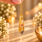 Golden Whisper suspended between fingertips