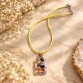 Graceful pendant on cream marble