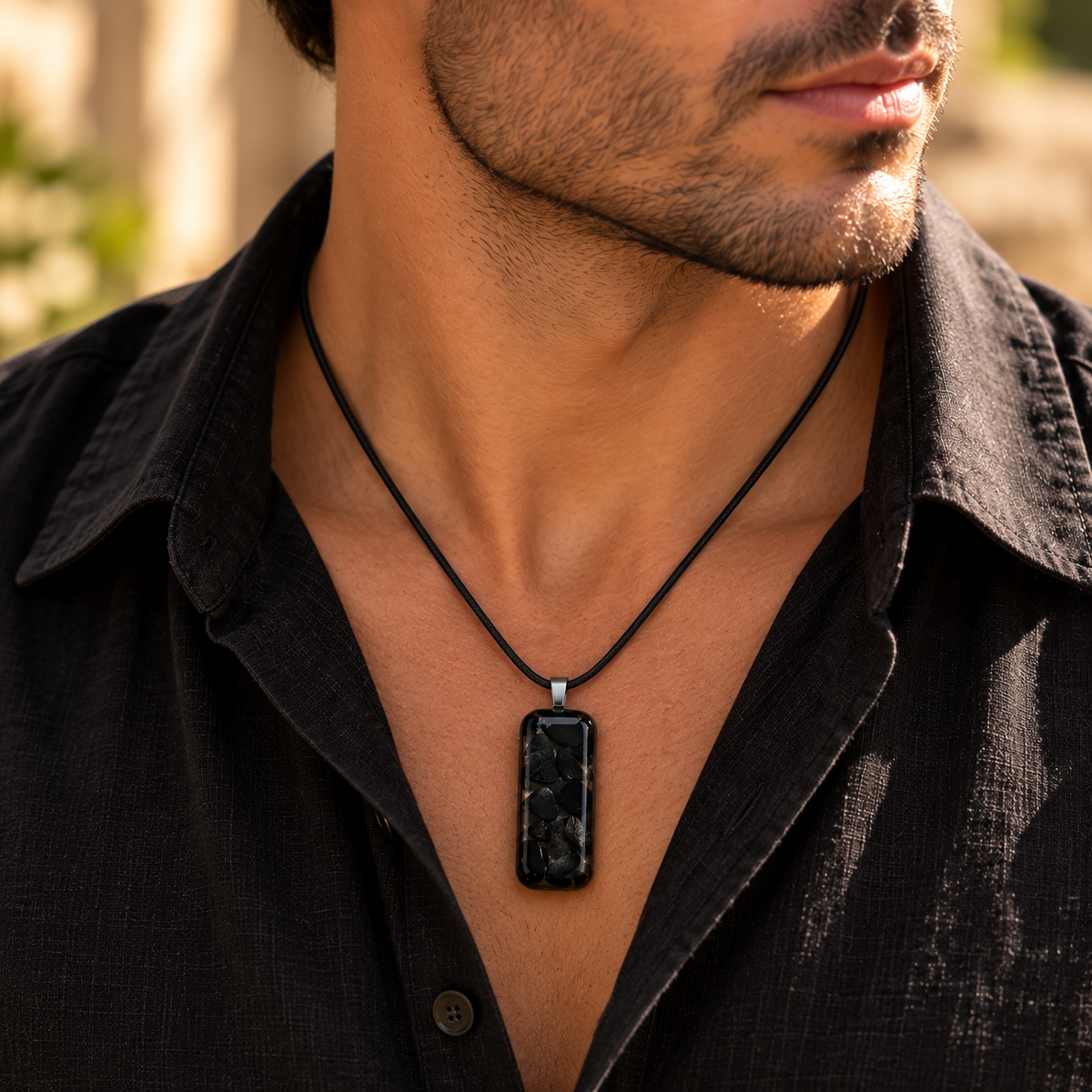 Mystique pendant worn by a man