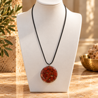 Resolute red jasper pendant on ivory bust with long black cord