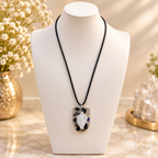 Serene pendant on ivory bust