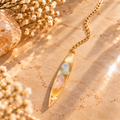 Soul Momentum pastel pendulum on warm marble