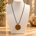 Steadfast Tiger's Eye pendant on ivory bust