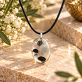 Stillness oval pendant on cream stone